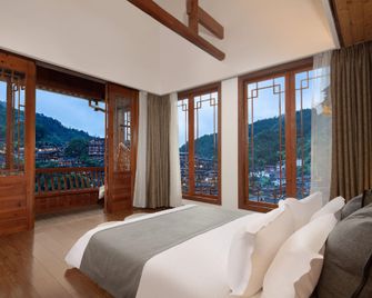 Xijiang Boyun·Inn (Qianhu Miaozhai Branch) - Qiandongnan - Bedroom