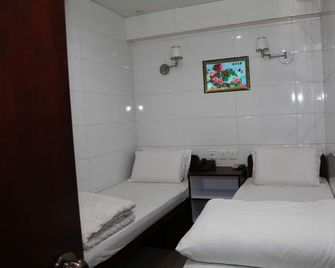 Pay-Less Guesthouse (7/F A9) - Hong Kong - חדר שינה