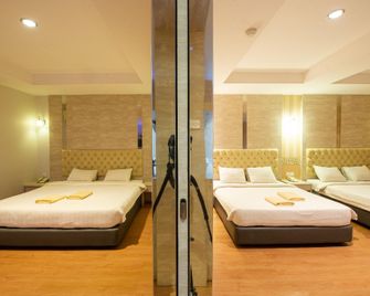 Lovina Inn Penuin Hotel - Batam - Makuuhuone