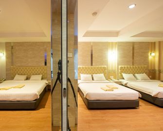Lovina Inn Penuin Hotel - באטאם קוטה - חדר שינה