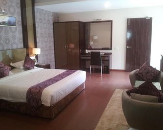 Saffron Hotel - Jālna - Bedroom