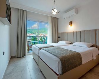 جولدن أورانج أبارت أوتل - مارماريس - غرفة نوم