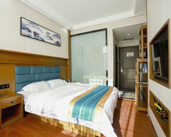 Xishuangbanna Yunpeng Hotel (The First People's Hospital) - Xishuangbanna - Schlafzimmer