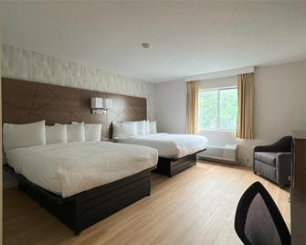 Baldwin Inn & Suites, SureStay Collection by Best Western - West Springfield - Bedroom