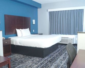 Magnolia Inn and Suites Olive Branch - Olive Branch - Slaapkamer