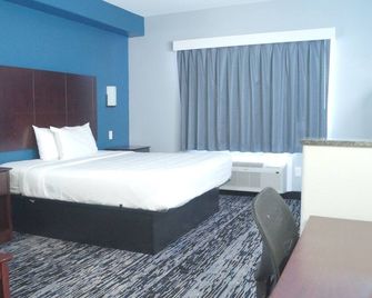 Magnolia Inn and Suites Olive Branch - Olive Branch - Ložnice