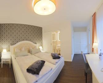 هوتل ستراندفيلا جانيني - بوركوم - غرفة نوم