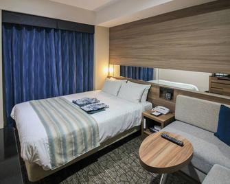 ألمونت هوتل ناها كينتشوماي - ناها - غرفة نوم