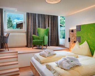 Genusshotel Fichtenhof - גרוסארל - חדר שינה