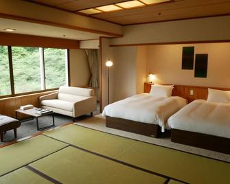 Yuze Hotel - Kazuno - Schlafzimmer