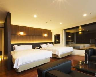Kannawa Onsen Hotel Sansuikan - בפו - חדר שינה