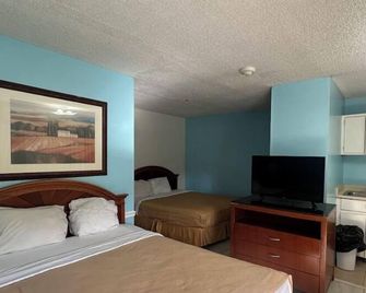 Guest Cottages & Suites, Brunswick Ga - Brunswick - Schlafzimmer