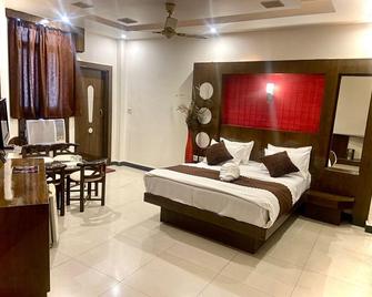 Hotel Krishna Heritage - Харідвар - Спальня