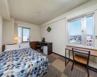 Mizusawa Green Hotel - Oshu - Slaapkamer