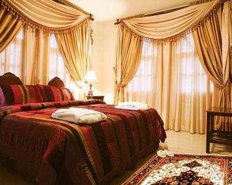 테오도스 로지 호텔 바이 한사 - 바트룬 - 침실