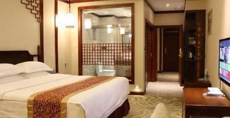 Xishu Sunshine Garden Hotel - Panzhihua - Bedroom