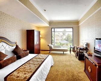 Pacific International Hotel - Deyang - Спальня