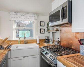 Welcome to 54 West Lake Shore Drive, a charming, single-floor home near the peaceful shores of Lake Champlain. This 1,200-square-foot residence offers 2 bedrooms (1 King, 1 Queen), 1.5 bathrooms with a shower and soaker tub. The thoughtfully designed - Colchester - Kitchen