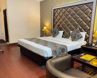 Mansarover Paradise Hotel - Morādābād - Camera da letto