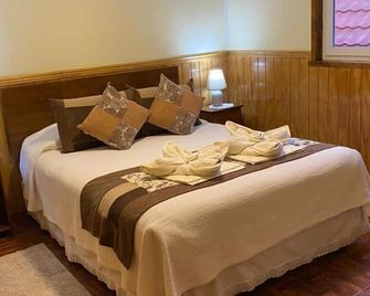 Hostal America en Puerto Natales - Puerto Natales - Bedroom