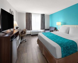Howard Johnson by Wyndham Romulus Detroit Metro Airport - Romulus - Habitación