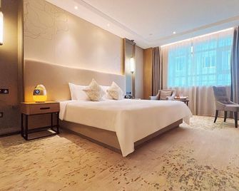Wuhan Hongguang Hotel - Wuhan - Camera da letto