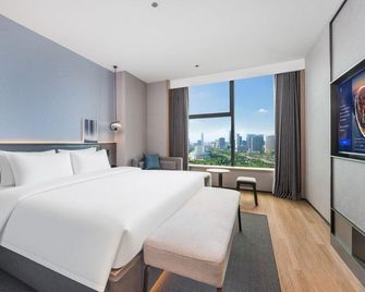 Radisson Country Inn & Suites Guiyang North Railway Station - Guiyang - Schlafzimmer