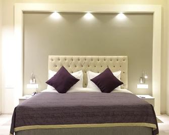 Mango Hotels Naveen - Davangere - Bedroom