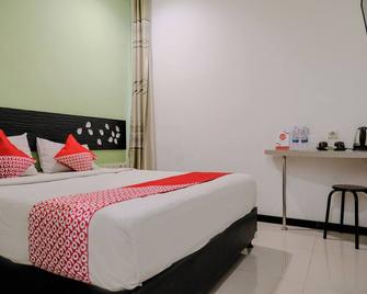 Hotel O Symphony Homestay Tlogomas - Malang - Slaapkamer