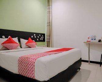 Hotel O Symphony Homestay Tlogomas - Маланг - Спальня