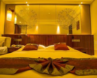 Crown Hotel - Xishuangbanna - Schlafzimmer