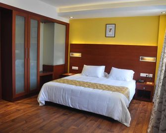 Hotel Niya Regency - Thrissur - Bedroom
