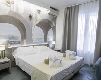 Hotel L'approdo - Castiglione della Pescaia - Спальня
