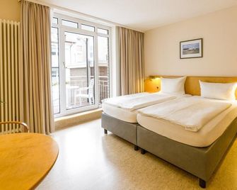 Michels Gästehaus Meerzeit - Norderney - Yatak Odası