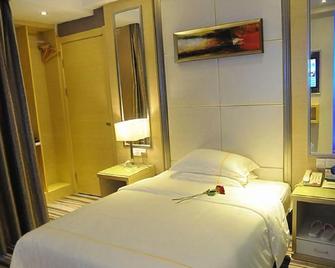 Sheng Jing Yi Jia Hotel - Xiangyang - Bedroom