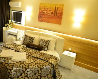أكسان هوتل - ازمير - غرفة نوم