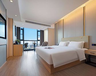 Zhangjiajie Hero Boutique Hotel - Čang-ťia-ťie - Ložnice