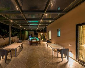 SaffronStays Eden - 3BR vineyard-side pool villa with jacuzzi, farm dining, stargazing deck & lawns for celebrations - Nashik