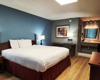 Executive Inn By OYO Queenville Mena - Mena - Schlafzimmer