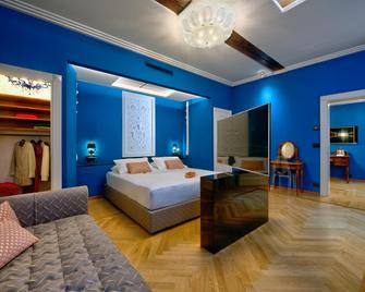 آرت هوتل كوميرسيانتي - بولونيا - غرفة نوم