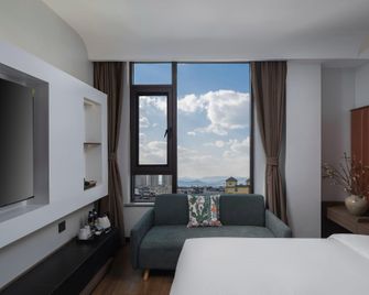 Hualan Xi Hotel (Yuxi Wanda Plaza Extreme Center Store) - Yuxi - Bedroom