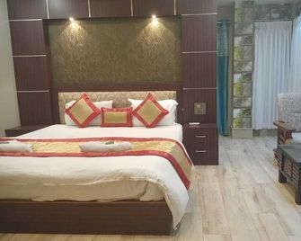 The Brahmaputra Hotel - Rupsi - Kamar Tidur