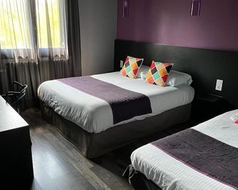 Logis Hôtel La Fontaine - Mantry - Schlafzimmer