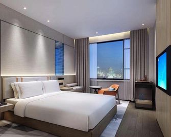 Mo Ning Hotel (Qingdao North Railway Station Branch) - Qingdao - Bedroom