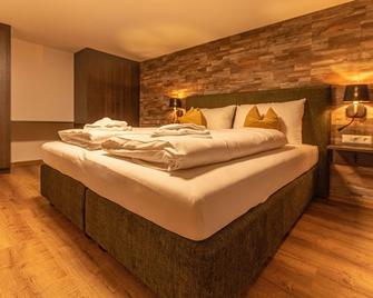 Tevini Boutique Suites by we rent - Zell am See - Schlafzimmer