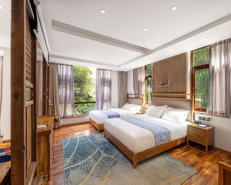 Aiduo Xiaozhu Hostel - Ya'an - Bedroom
