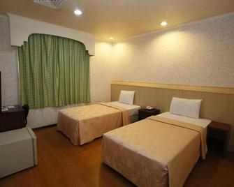 The Prince Hotel - Tainan - Schlafzimmer