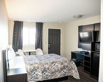 Capri Inn and Suites - Howell - Habitación