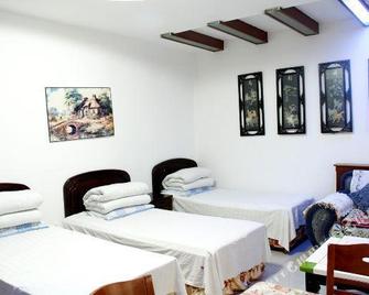 Longquan Hotel - Xinzhou - Slaapkamer