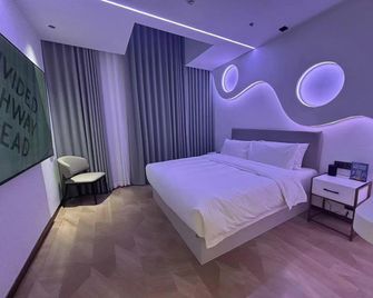Aizhu Future Hotel (Handan Road Branch) - Handan - Schlafzimmer